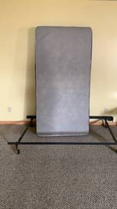 lot 2011 image: Twin size box spring and frame located in basement