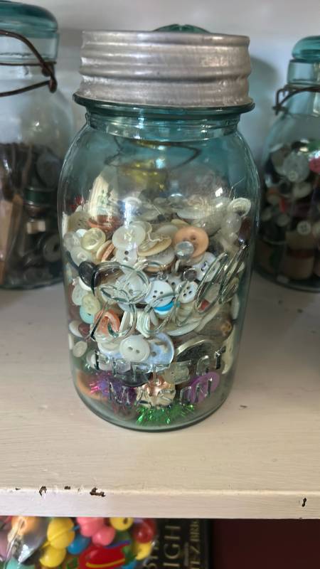 lot 40277 image: Mason Jar Filled with Mixed Buttons and Sewing Notions