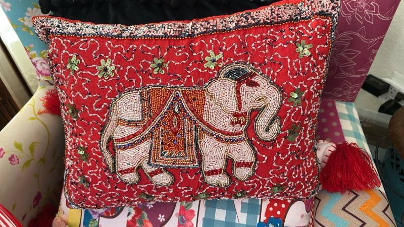 lot 40329 image: Handcrafted Beaded Elephant Decorative Pillow with Red Tassel