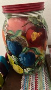 lot 110 image: Hand Painted Glass Mason Jar with Red Lid and faux fruit inside