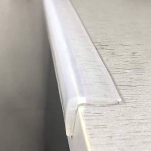 lot 31195 image: Clear 100% Silicone Edge Protector for Baby Proofing, Pre-Taped Furniture Wall Corner Guards, Damage-Free Toddler Bumper Strip for Wood Mable Table - Retail $13