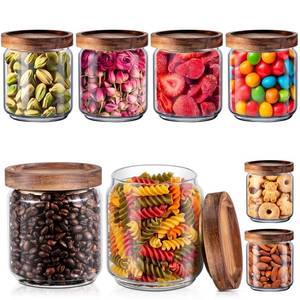 lot 61981 image: Irenare 8 Pack Glass Containers Canister Set, 17 oz Food Storage Spice Jars with Airtight Lids, Clear Kitchen Containers for Coffee Sugar Tea Beans Nuts Candy Pantry Organization (Wood) - Retail $36