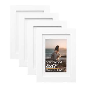 lot 32703 image: KINLINK 4x6 Frame White, Solid Wood 4 x 6 Picture Frame with Acrylic Plexiglass for 3.5x5 with Mat, Tabletop and Wall Display Photo Frames 4x6 White, 4 Pack - Retail $17