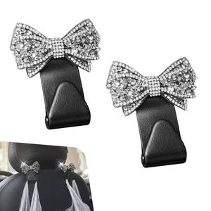 lot 26544 image: Teybouk 2 PCS Bling Bow Purse Hook for Car, Cute Seat Headrest Hooks, Automotive Interior Decoration Accessories, Universal for Most Cars, Trucks, SUVs (Black) - Retail $6