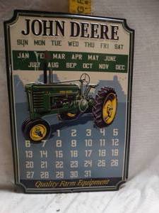 lot 25029 image: John Deere Calendar Metal Sign.
