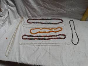 lot 24965 image: Several Flat Stone Knecklaces.