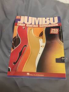 lot 808 image: Jumbo Easy Guitar Songbook - 245 Songs - Retail $15