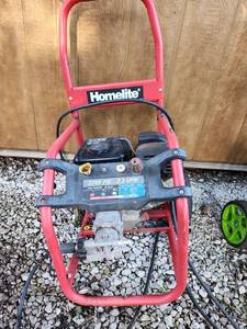 lot 106 image: Homelite 2700 PSI Gas Pressure Washer with Wheels - Worked Last Year - Tire Got Broken Off