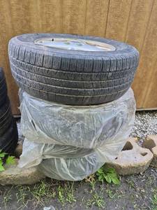 lot 112 image: GM Pontiac Grand Prix Alloy Wheels and Tires Set - All Match