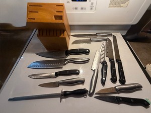 lot 113 image: Chicago Cutlery & Multi-Brand 14-Piece Professional Knife Collection with Wood Storage Block