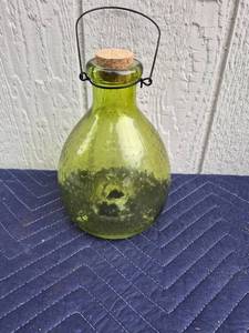 lot 358 image: Green Glass Demijohn with Cork and Wire Handle