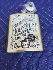 lot 410 image: Moonshine Hip Flask with Decorative Label