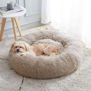 lot 3150 image: Calming Dog Bed & Cat Bed, Anti-Anxiety Donut Cuddler Warming Cozy Soft Round Bed, Fluffy Faux Fur Plush Cushion Bed 24.0L x 24.0W x 7.0