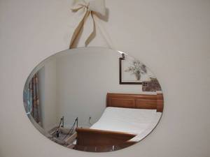 lot 909 image: Oval Frameless Wall Mirror 17x24 inch.