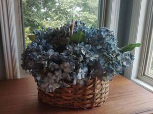lot 935 image: Artificial Blue Flower Arrangement in Wicker Basket