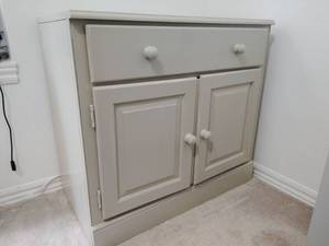 lot 945 image: Tan Painted Wooden Sideboard Cabinet 29.5x19x32 in.
