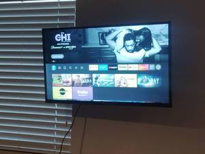 lot 1014 image: 32 Flat Screen TV  and Remote with Wall Mount Bracket Located in Basement Bring (Tools To Take Bracket Off of Wall)