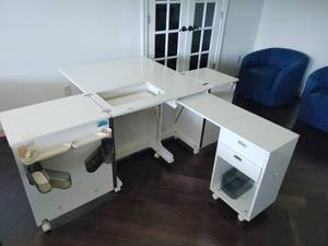 Adjustable White Craft and Sewing Machine Cabinet with Storage Largest 30x76x74 in Smallest 30x17x38 in Located in Basement