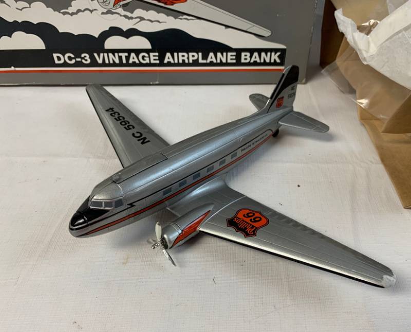 lot 8034 image: Phillips 66 - Limited Edition - 1 of 5000 - Die-Cast Metal - DC-3 Vintage Airplane Bank - Baked Enamel Finish - Pad Printed Graphics