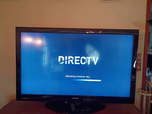lot 921 image: 64in. Toshiba TV with Remote