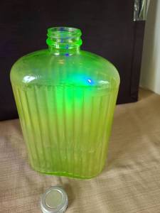 lot 1005 image: 1920s Anchor Hocking Ribbed Green Uranium Glass Refrigerator Water Bottle