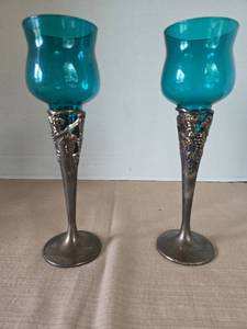 lot 1011 image: Pair of Teal Glass Hurricane Candle Holders with Ornate Metal Stems