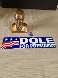 lot 1045 image: Eisenhower bank, promotional item from Wichita Federal Savings and Loan, an I Like Ike campaign pin, and Dole for President bumper sticker