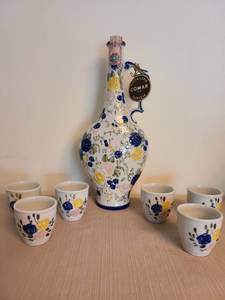 lot 1101 image: Hand Painted Floral Ceramic Decanter with 6 Matching Cups Set