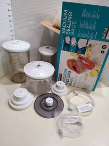 lot 1416 image: Food Saver Vacuum Sealer parts and sealing bags.