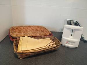 lot 1546 image: Wicker Baskets, Napkins and a Toastmaster Toaster