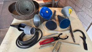 lot 4138 image: Metal oil pan, Different sizes of Funnels, Clamps and more
