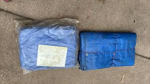 lot 4409 image: Two Large Tarps. New one is 19x29