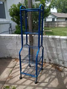 lot 5502 image: Blue Rolling Rack.  67 x 17.5 x 22