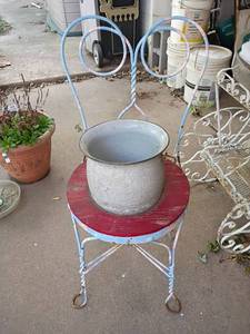 lot 5508 image: Wooden and Metal Chair with Chamber Pot.  Turned into plant pot.   35in tall