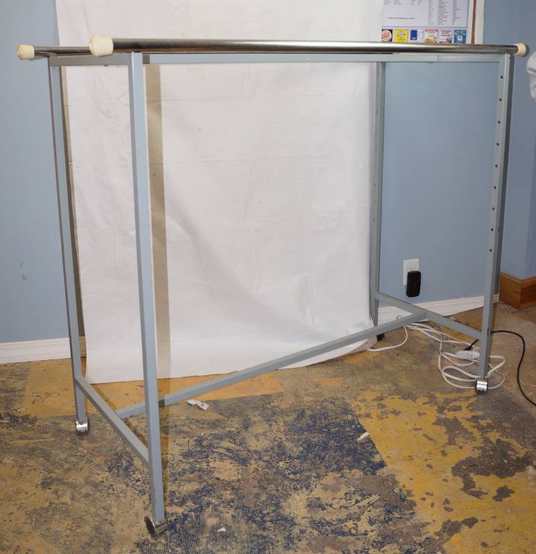 lot 6205 image: Rolling Clothes Storage Rack - Holds 2 rows of clothes - Clean