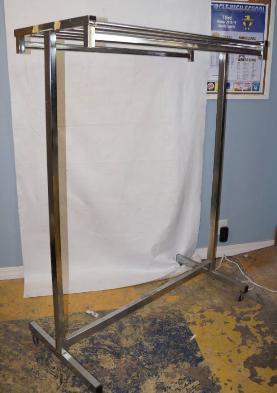 lot 6206 image: Rolling Clothes Storage Rack - Handy to have