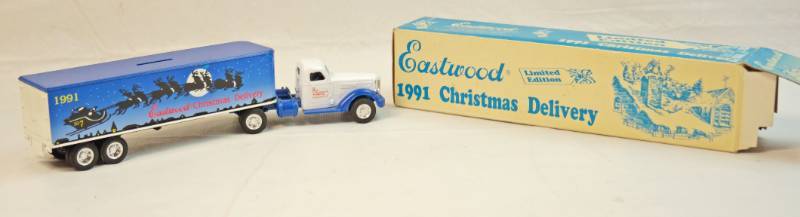 lot 6252 image: ERTL Collectible Eastwood Christmas Delivery Santa and sleigh truck cab with box trailer w original box- Has a coin slot on the trailer No 9122 1991