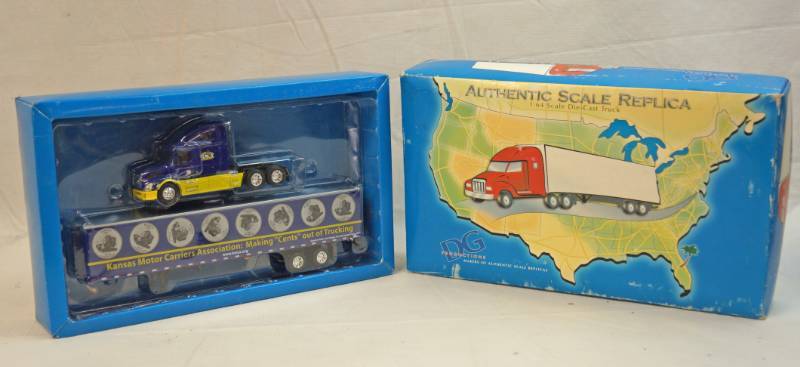 lot 6264 image: Kansas Motor Carriers Association Die Cast Collectible-Semi truck cab and box trailer-DG Productions Authentic Scale Replica -164th Scale Model -in original packaging