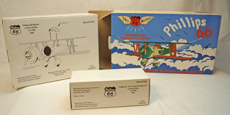 lot 6319 image: Phillips 66 Sky Writer bi-plane bank and 1936 Chevy Air Radio Car-Collectors Set- second in a series-Spec cast-limited edition-die cast metal-in original box- See pics-awesome find
