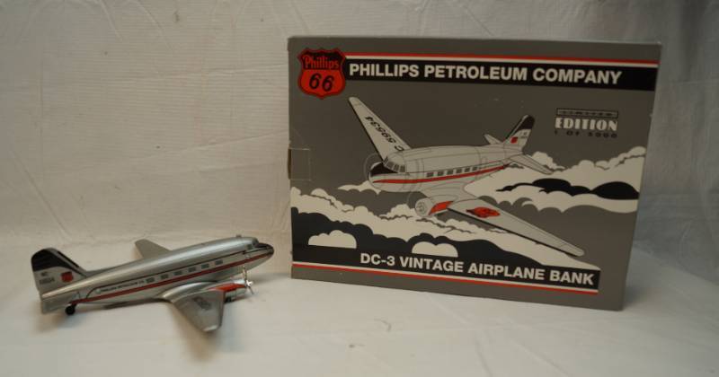 lot 6320 image: Phillips Petroleum Company DC-3 Vintage airplane bank-Spec cast-limited edition-die cast metal-in original box-1994- Stock number 45009