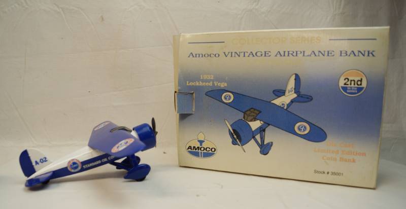 lot 6321 image: Amoco Vintage Lockheed Vega Collectors Series airplane bank-Spec cast-limited edition-die cast metal-in original box-1992- Stock number 35001