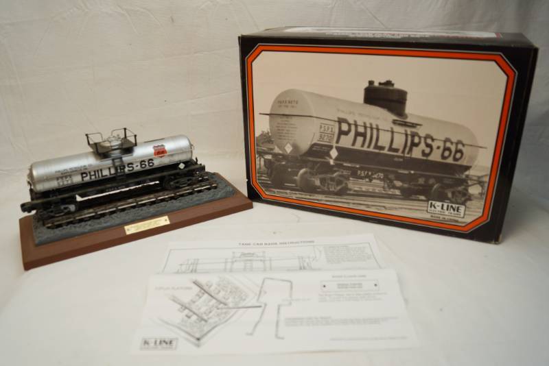 lot 6322 image: Vintage Die Cast -1930 K Line Phillips 66 Collectible railroad tank car bank -fully operational-only 1200 produced-commemorative numbered plaque on display platform -in original box-Nice find