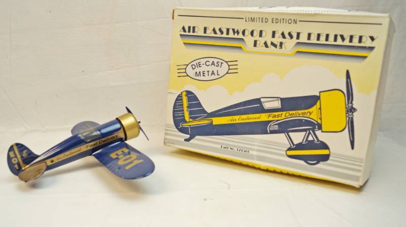 lot 6323 image: Die Cast metal collectible- Air Eastwood Plane bank- marked Fast Delivery E-01 in original box
