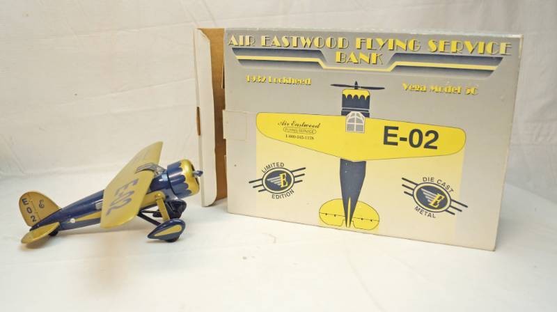 lot 6326 image: Die Cast metal collectible- 1932 Lockheed-Vega Model 5C-Air Eastwood Plane bank-second in the series- marked Flying Service E-02 in original box
