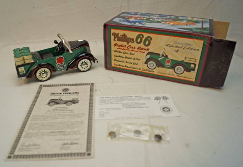 lot 6329 image: Crown Premiums Phillips 66 Pedal car bank-working pedal action-steerable front end-headlights and taillights-third edition-one of 1,250-in original box with paperwork-Super cute