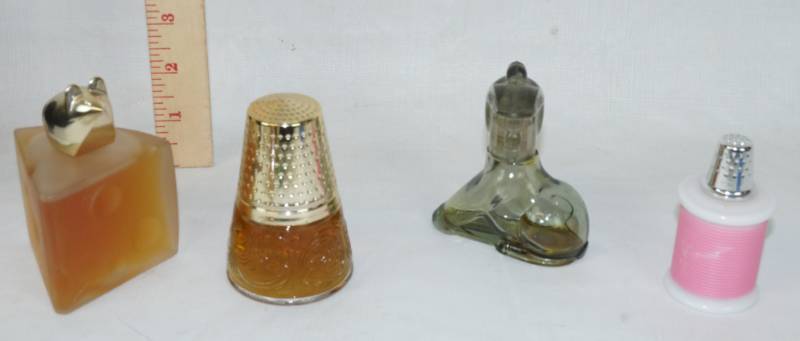 lot 6049 image: Lot of Vintage AVON Perfume Bottles - Most are full - see pics