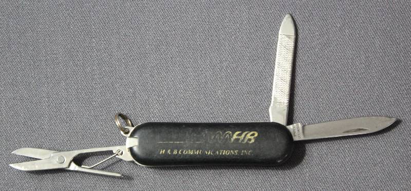 lot 9060 image: Vintage 2.25 Black Folding Multi-Tool Pocket Knife. H&B Communication Ad