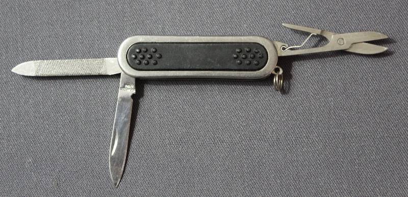 lot 9062 image: Metal and Hard Plastic Folding Multi-Tool Pocket Knife with Key Ring.