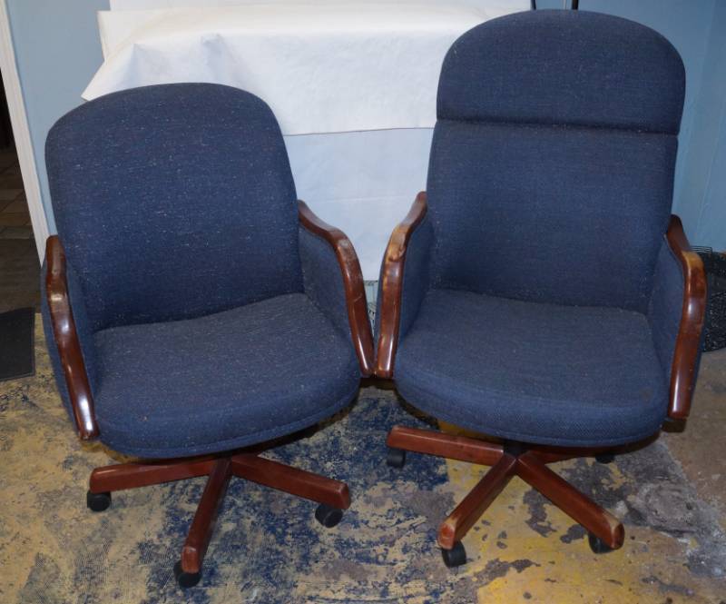 lot 5043 image: Two blue cloth rolling office chairs -one tall back -one short back-with wood trim-see pics for exact size