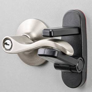 lot 3124 image: Door Lever Lock (2 Pack) Prevents Toddlers from Opening Doors. 3.25 L  1.5 W  4.5 H Easy One Hand Operation for Adults. Durable ABS with 3M Adhesive Backing. Simple Install, Black - Retail $13